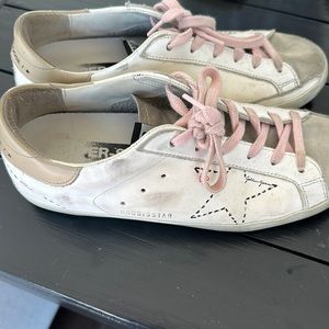 Golden Goose white sneaker size 38 with pink laces.